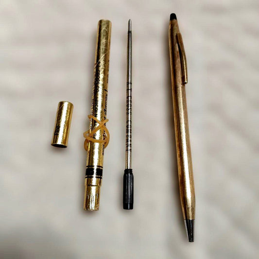 Gold-colored ballpoint pen with replacement ink cartridge, Japanese import, brand unknown
