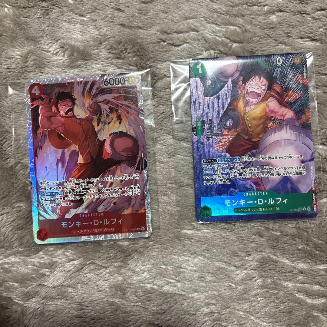 One Piece Monkey D. Luffy OP16-034R trading card with bonus OP16-015SR displayed with sleeve