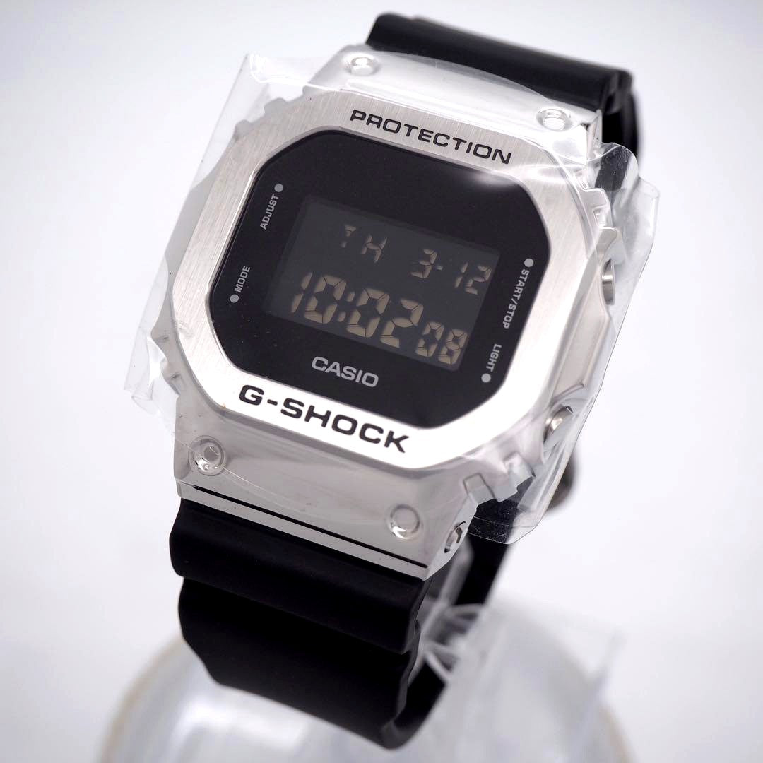 Casio GM-S5600 men's digital watch with metal band and box, Japan import, showing front display and strap
