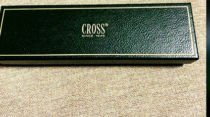 Cross silver ballpoint pen displayed with its dedicated case on a white background