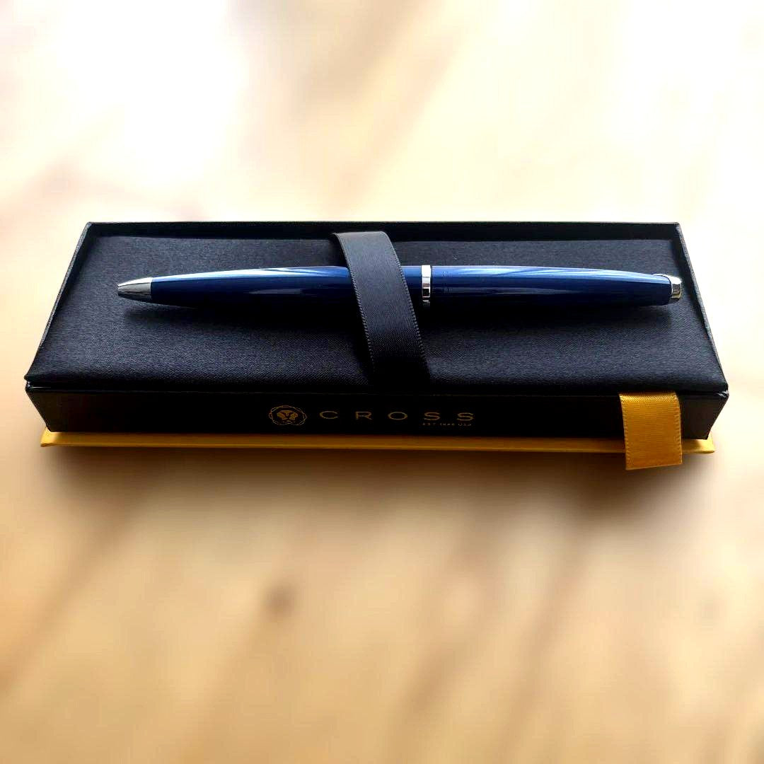 Cross ballpoint pen with blue body, silver accents, and included gift case