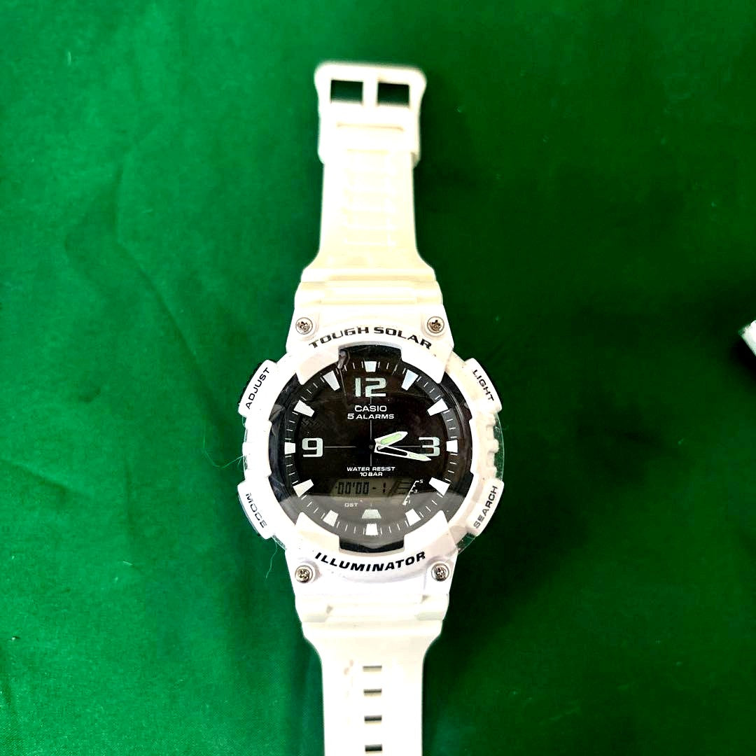 Casio Model 5208 solar digital watch with white resin band and white dial showing LED display