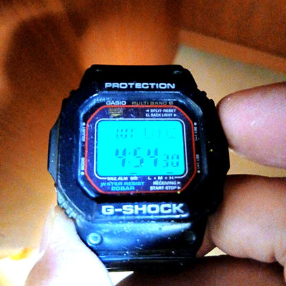 Used Casio G-Shock GW-M5610 Digital Radio Solar Watch from 2012 with scratched glass and digital display