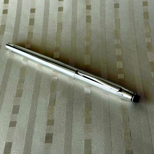 Cross silver plated cap-type rollerball pen made in USA with sleek design and silver body