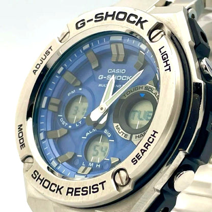 Casio G-Shock GST-W110D-2AJF blue watch with stainless steel band, clear face, and digital-analog display