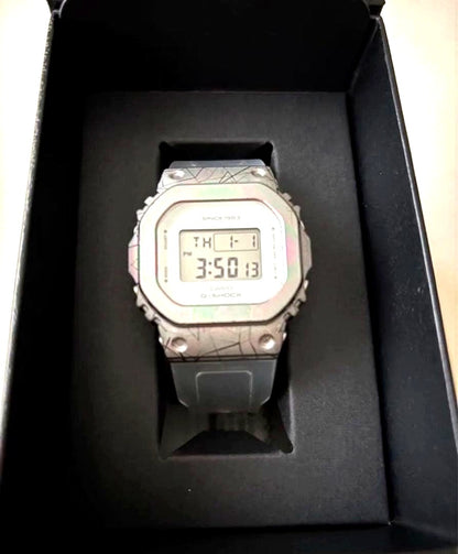 Casio G-Shock GM-S5640GEM-7JR 40th Anniversary unisex digital watch with silver metal bezel and white band