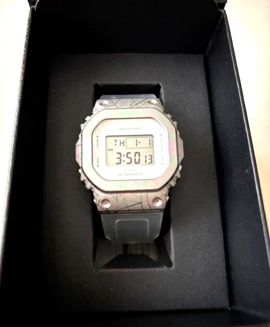 Casio G-Shock GM-S5640GEM-7JR 40th Anniversary unisex digital watch with silver metal bezel and white band