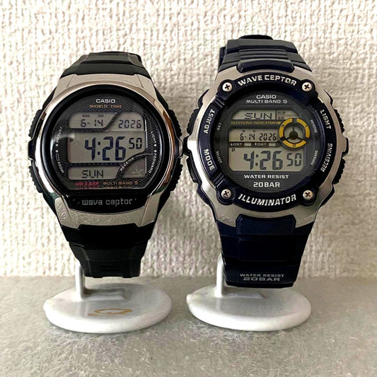 Casio Waveceptor WV-M200 and WV-58J digital watches set with Multi Band 5 and backlight, shown side by side