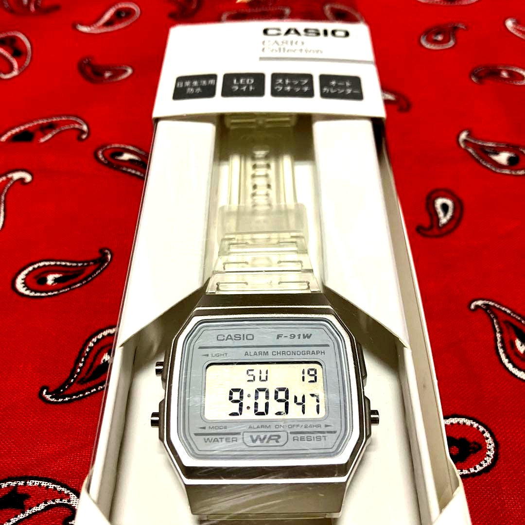 Casio F-91W digital watch in clear plastic case and band with a black digital display