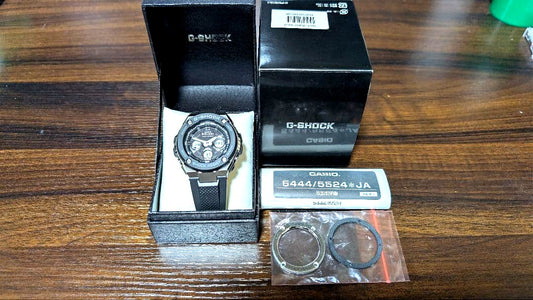 Two silver faceplates for Casio G-Shock GST-W300-1AJF with slight scratches and wear