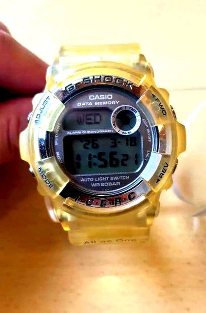 Casio G-Shock clear yellow digital watch with stainless steel back from the Seventh International Dolphin Wave Tournament