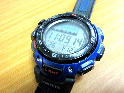 Casio Protrek PRG-40 Blue Model Watch showing blue body, black rotating bezel, and artificial leather band