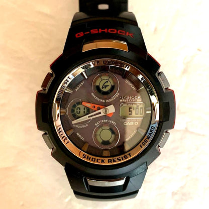 Casio G-Shock GW-1100J model watch with visible scratches and dirt, front view