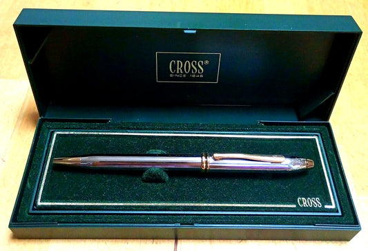 Cross ballpoint pen with metal body and blue ink displayed with its dedicated case and manual