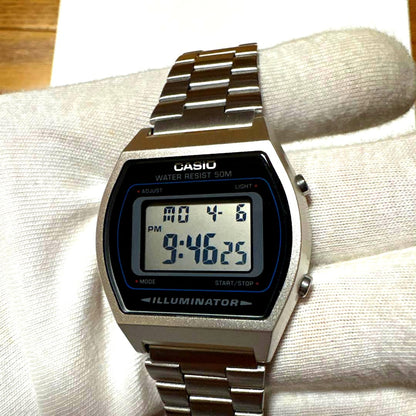 Casio W-202 digital watch with illuminator feature, black band, brand new protective film on glass