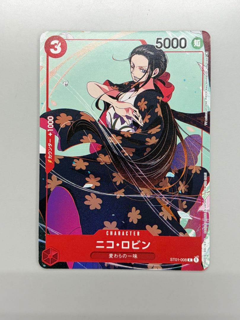One Piece Matching Battle Nico Robin ST01-008 promotional Japanese card showing front and back with a dent on the top left corner