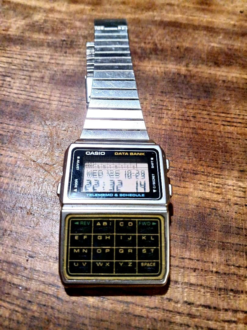 Casio Data Bank Model DBC-610 digital calculator watch with stainless steel link band and digital display