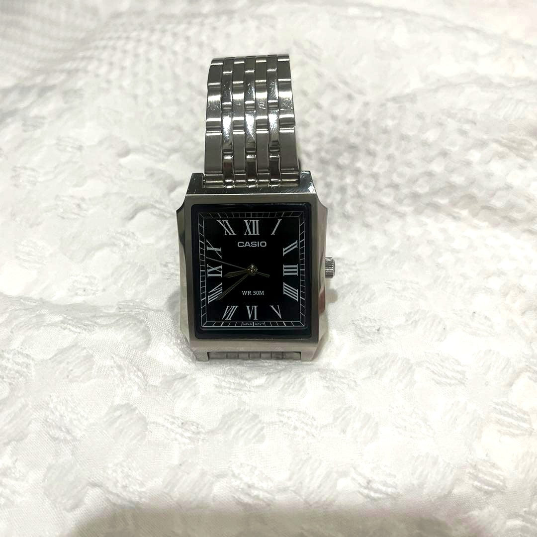 Casio MTP-B190D watch with black dial featuring Roman numerals and silver stainless steel band