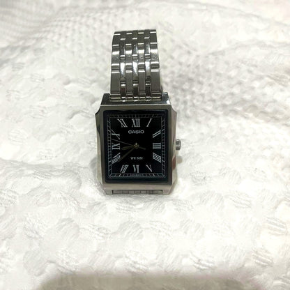 Casio MTP-B190D watch with black dial featuring Roman numerals and silver stainless steel band