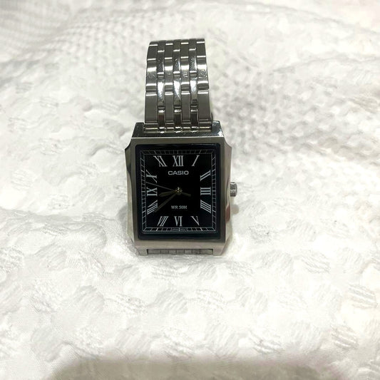 Casio MTP-B190D watch with black dial featuring Roman numerals and silver stainless steel band