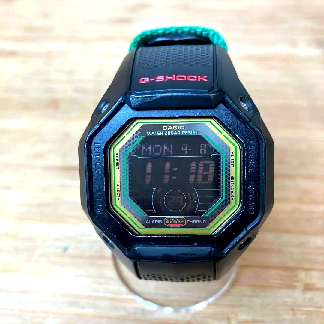 Casio G-Shock G-056RE digital wristwatch with black resin band and digital display showing time
