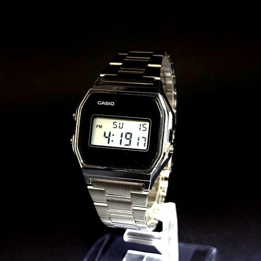 Casio A158WA-1JF vintage black digital-analog wristwatch with black finish and functioning display