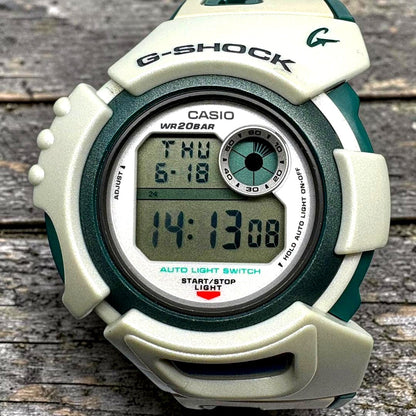 Casio G-Shock X-treme G-LIDE DWX-100 digital watch with black rubber band and illuminated digital display
