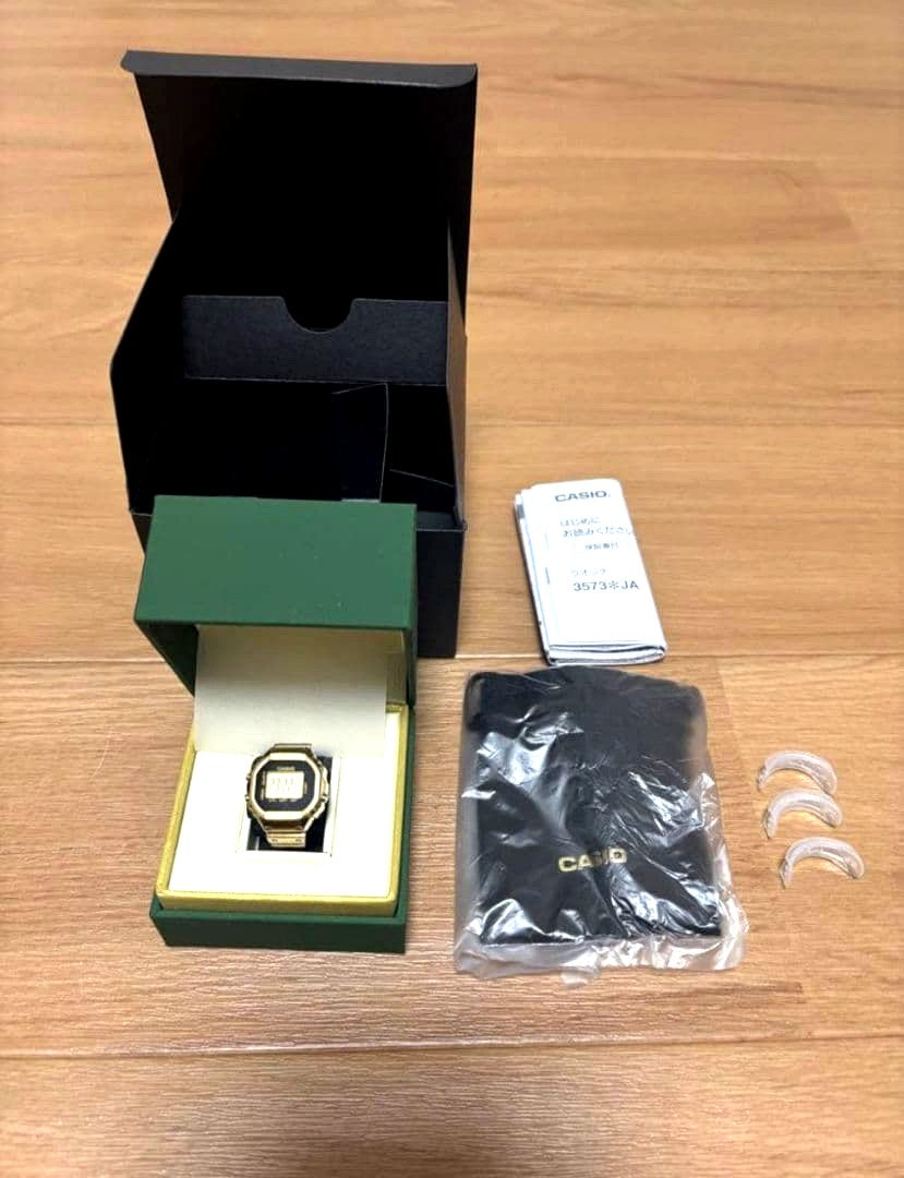 Casio Ring Watch Gold CRW-001G showing front face with minor scratches and new screen protector