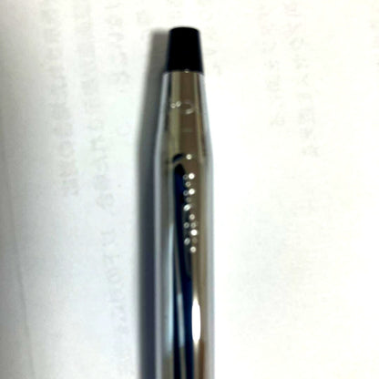 Cross ballpoint pen with black ink and twist-type mechanism on a white background