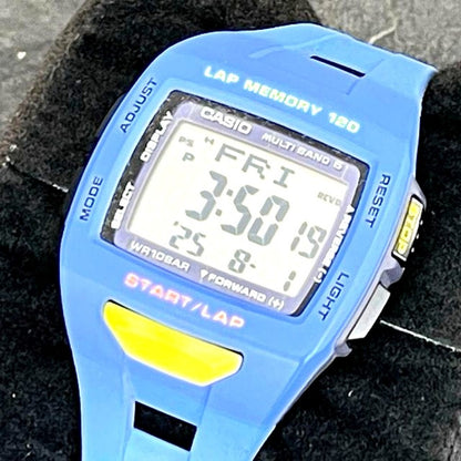 Casio Phys Fizz STW-1000 Solar Radio-Controlled Digital Watch with visible scratches and color-faded band