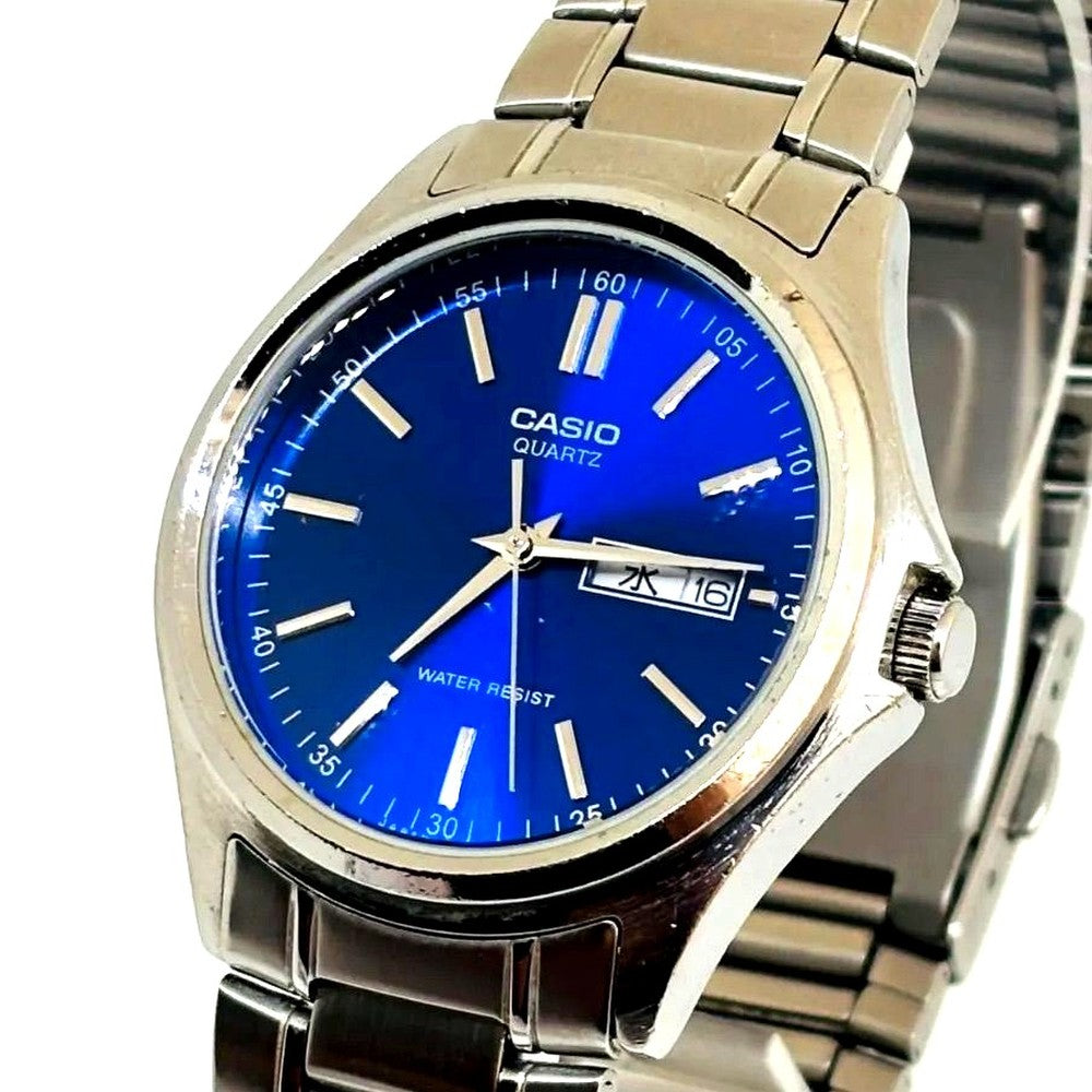 Casio MTP-1239DJ men's quartz watch with blue dial and stainless steel case showing day and date display