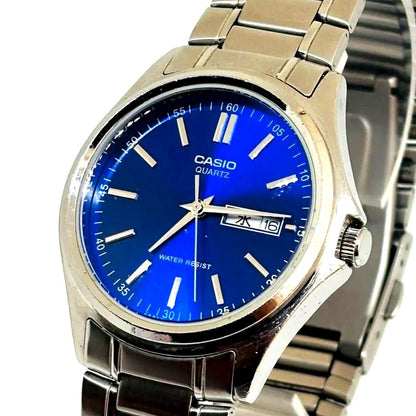 Casio MTP-1239DJ men's quartz watch with blue dial and stainless steel case showing day and date display